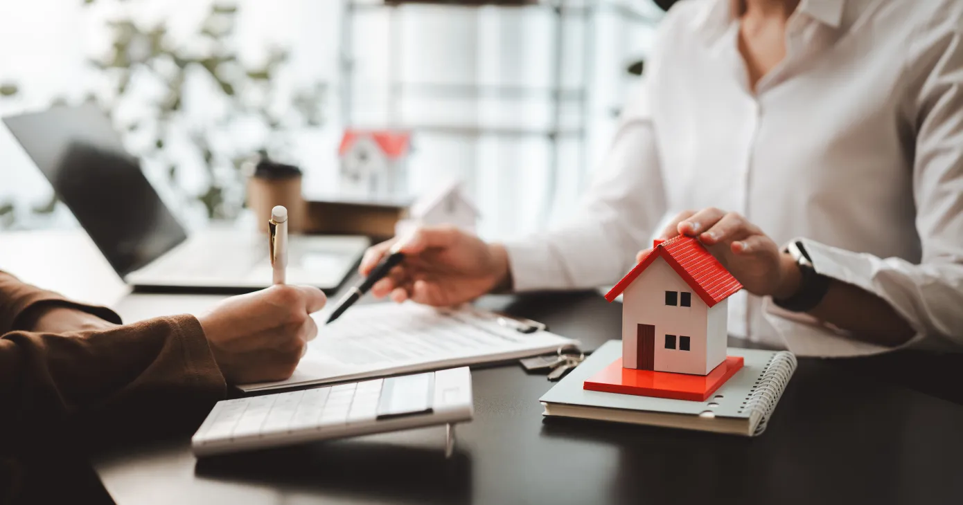 Business professionals meet with real estate agents to discuss real estate investments
